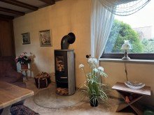 2. Wohnzimmer mit Kaminofen Zwei PV-Anlagen und ein Batteriespeicher inklusive!