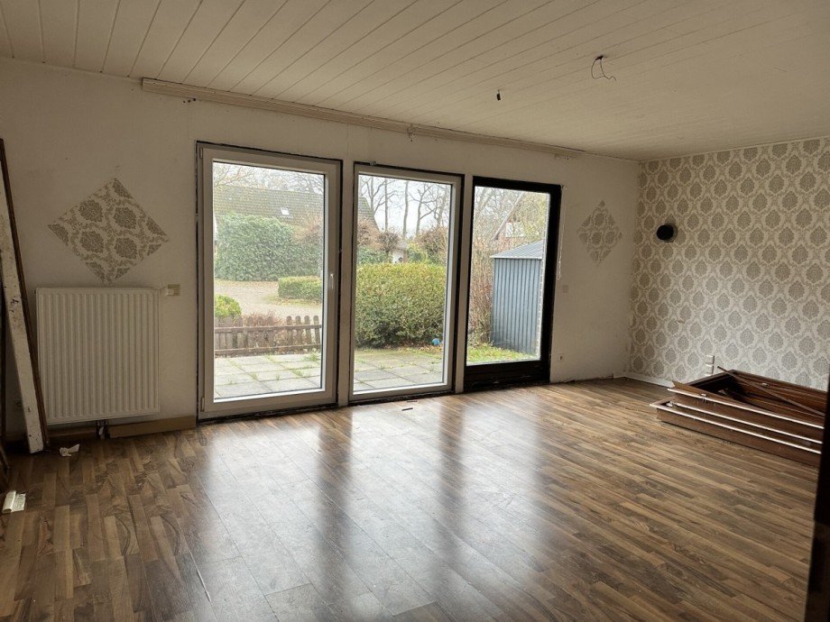 Haus 1: Wohnzimmer Zweifamilienhaus Wiefelstede / Bokel